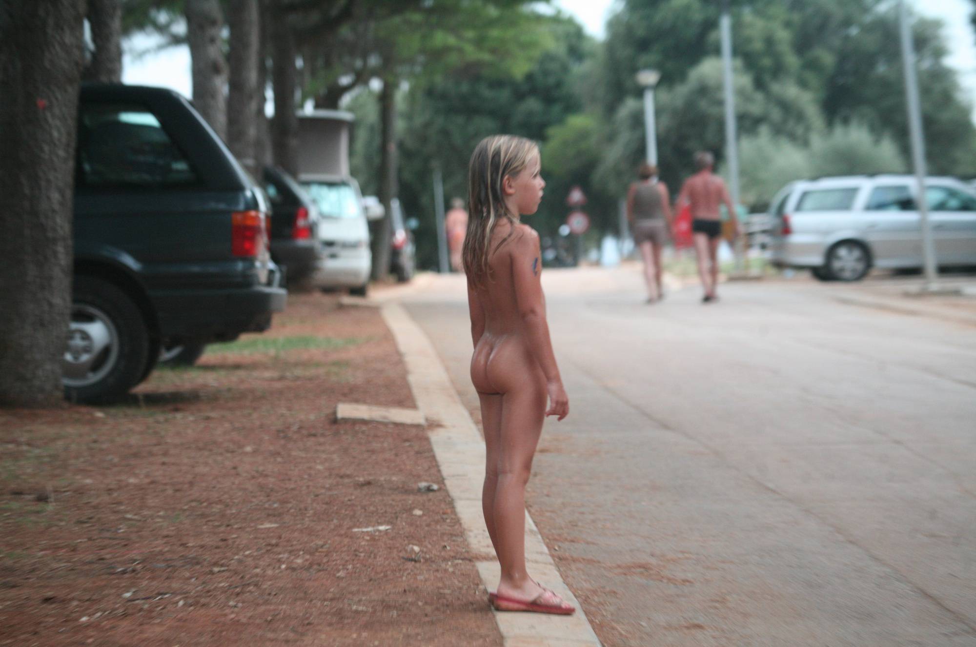 Naturist Child on Sidewalk - 1